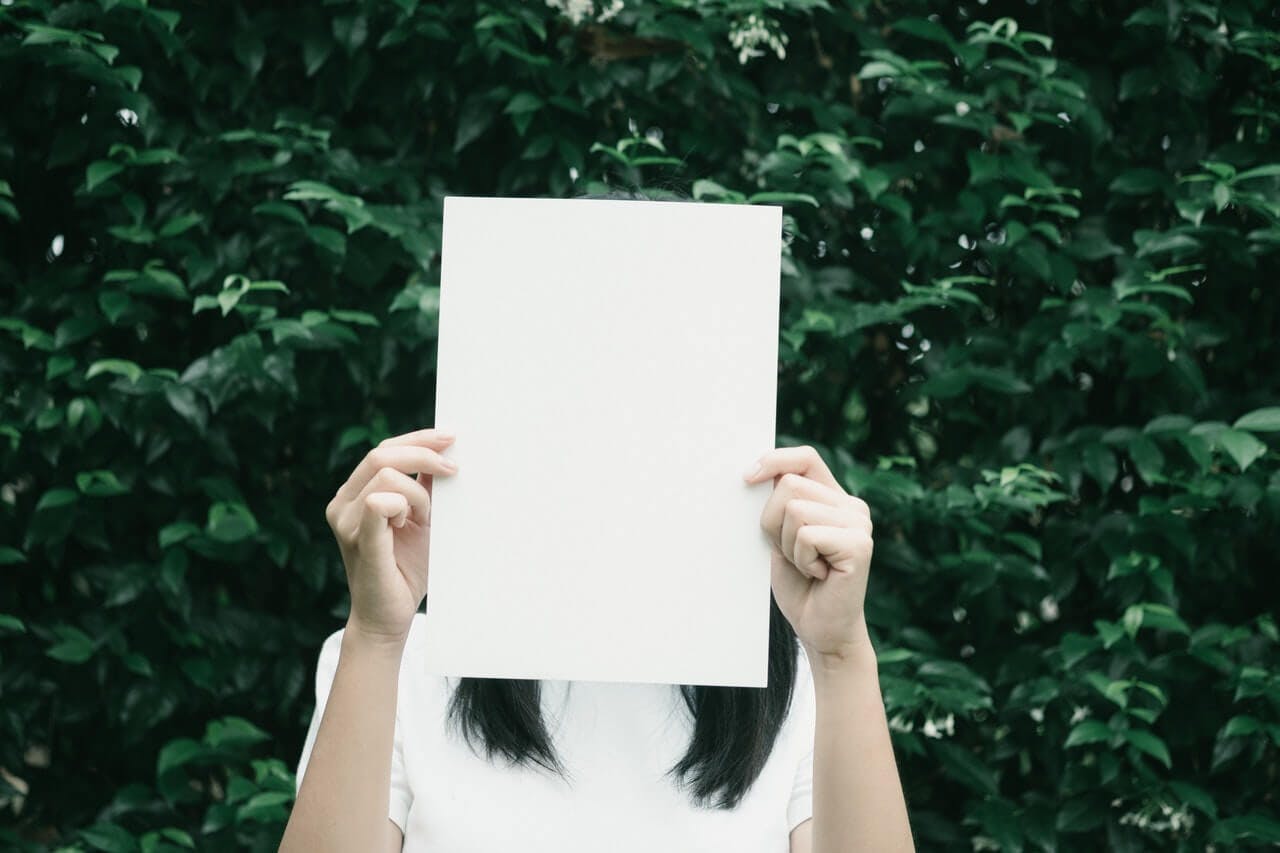 Woman holding paper